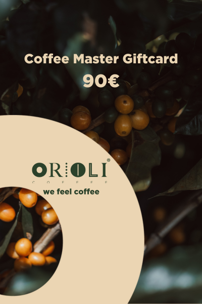 Orioli Coffee Master Giftcard with coffee beans and leaves on a dark background