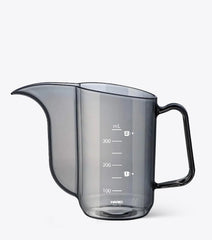 Hario gray measuring cup with black handle on a white background