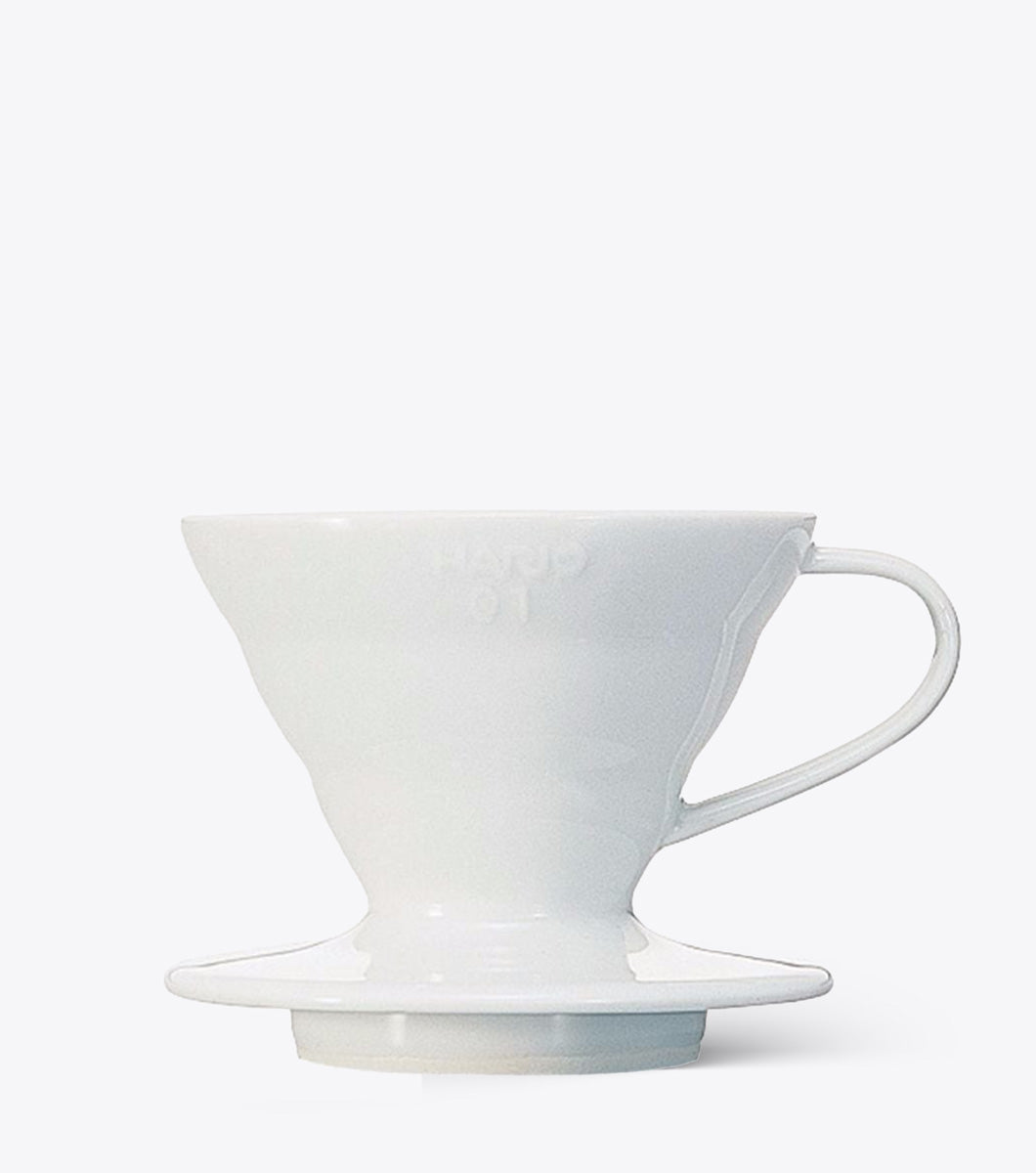 White ceramic coffee dripper on a white background
